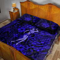 Navy quilt bed set with hula girl motif and ornate swirl pattern, includes matching shams