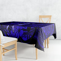 Navy blue tablecloth with Polynesian geometric swirls and palm motifs, draped