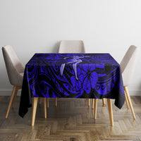 Navy blue tablecloth with Polynesian swirl and palm motifs, centered on table