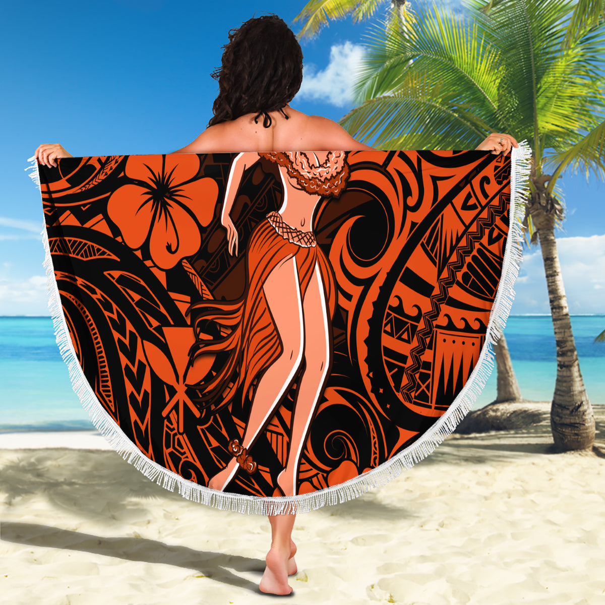 Round beach blanket with orange and black Polynesian hula girl graphic, white fringed edge