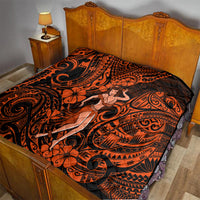 Orange and black Polynesian hula girl quilt covering a bed with tribal prints