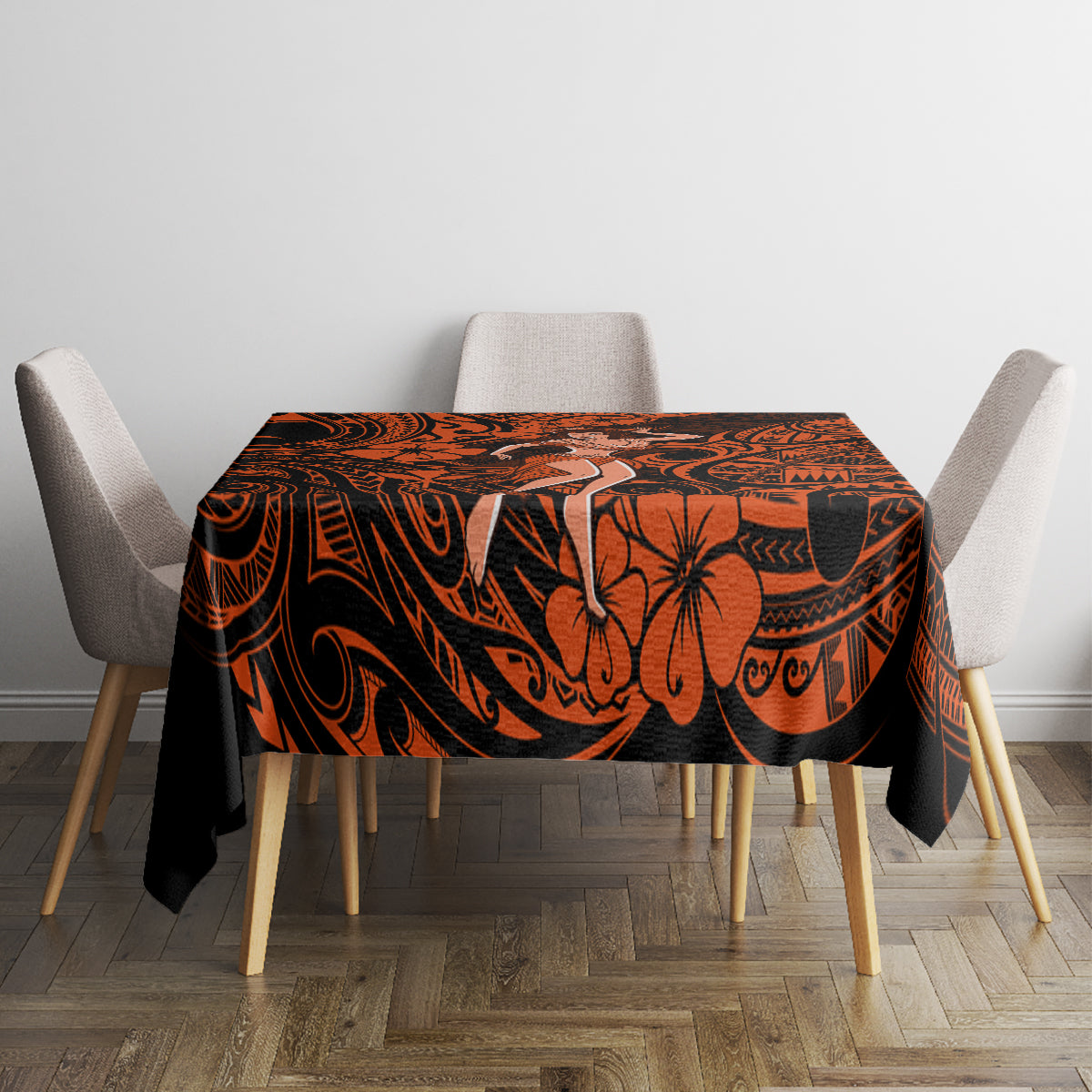 Orange and black Polynesian patterned tablecloth on dining table with chairs