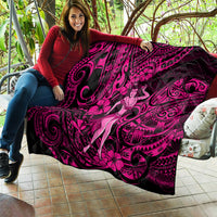 Pink and black Polynesian hula girl quilt held outdoors, featuring vivid swirl motifs