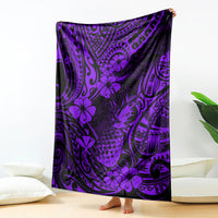 Purple Polynesian-style pineapple pattern blanket, draped and spread on a bed