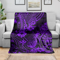 Purple pineapple-pattern blanket draped over a sofa as a throw