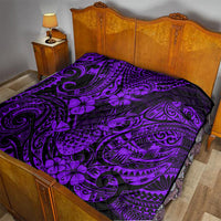 Purple and black patterned quilt on a bed, with pineapple and tribal swirl motifs
