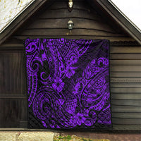 Purple and black Polynesian quilt displayed indoors, with pineapple flower and swirl design