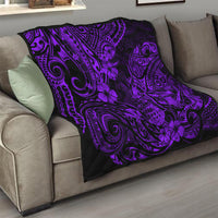 Purple and black quilt blanket on a sofa, with ornate swirls and pineapple flower motifs