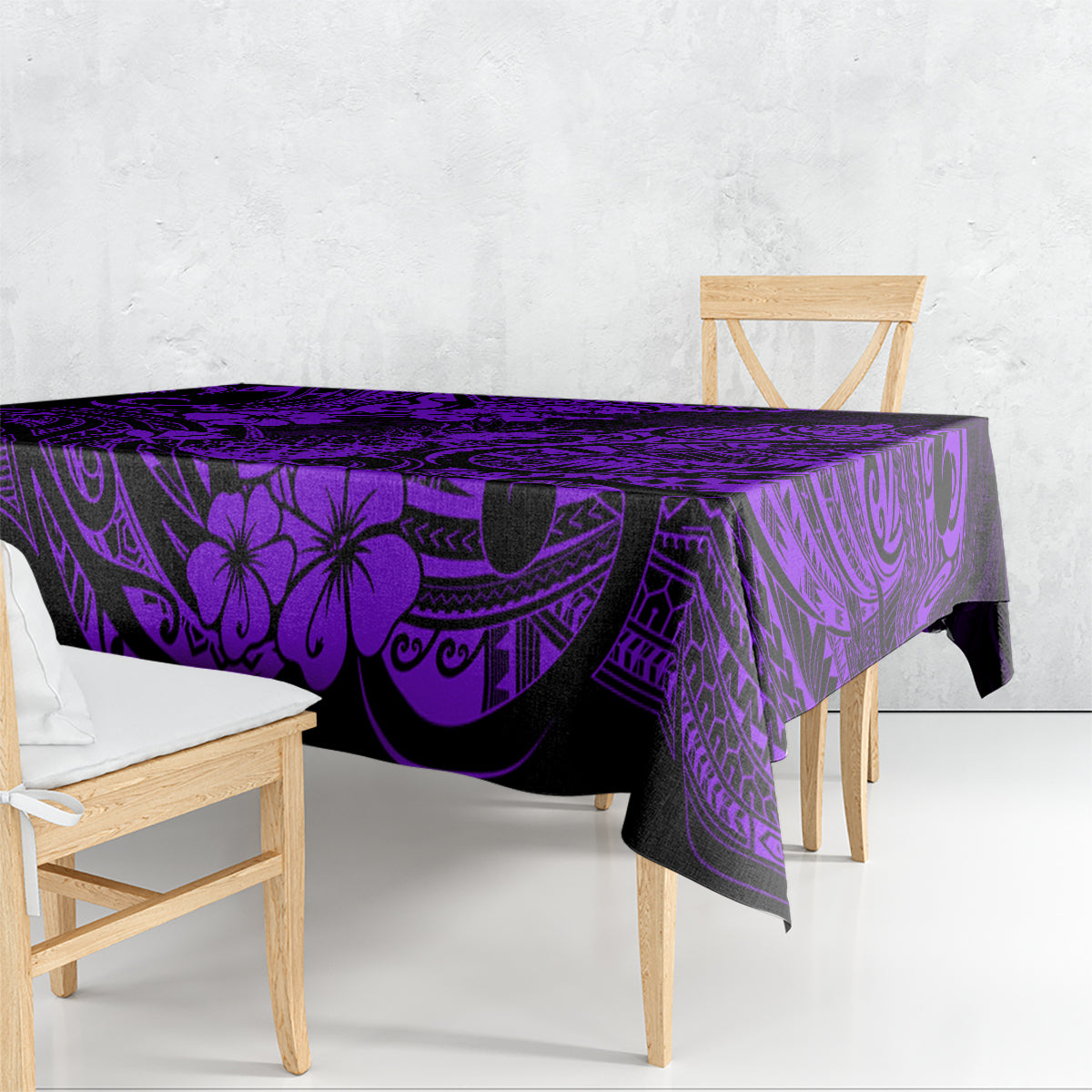 Purple and black tablecloth draped over outdoor dining table, tropical tiki print