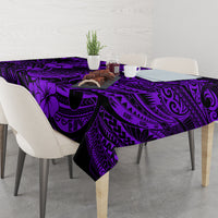 Purple and black tropical tiki tablecloth on dining table with chairs, corner drape