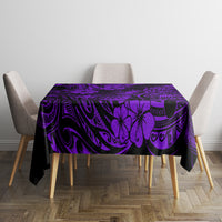 Purple and black tropical tiki tablecloth over rectangular table with four chairs