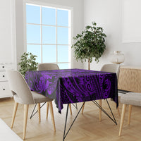 Purple tropical tiki tablecloth covering dining table with five chairs and plants