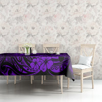 Purple and black tropical tiki tablecloth on sideboard with decor items