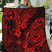 Red and black Polynesian pineapple quilt blanket with ornate swirl and flower pattern