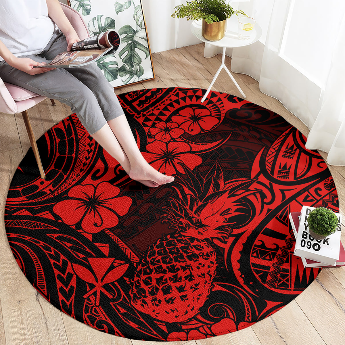 Red and black round rug with pineapple floral and tribal swirl motif pattern