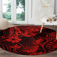 Red and black round rug with pineapple floral and tribal wave pattern