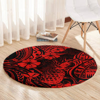 Red and black round pineapple patterned rug with tribal swirl and floral motif