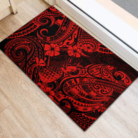 Red and black Polynesian patterned rubber doormat featuring swirling tribal motifs and hibiscus flowers
