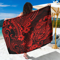 Red and black Polynesian-style print sarong with curved tribal motifs, draped wrap