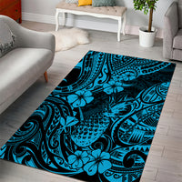 Rectangular sky blue area rug with Polynesian-inspired floral and tribal wave motifs