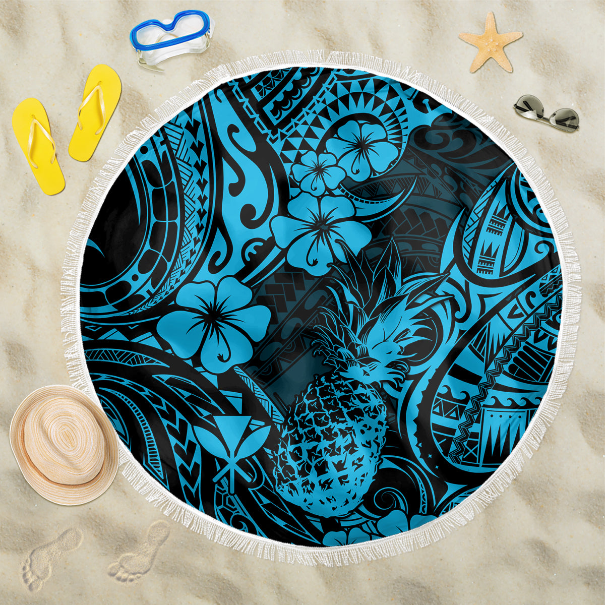 Round blue beach blanket with pineapple and hibiscus pattern, white fringe edge