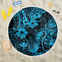 Round blue beach blanket with pineapple and hibiscus pattern, white fringe edge