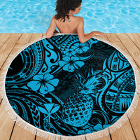 Round blue beach blanket with pineapple motif and hibiscus floral pattern, white fringe