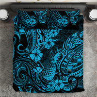 Blue and teal Polynesian-style bedding set with tropical floral and tribal pattern, folded