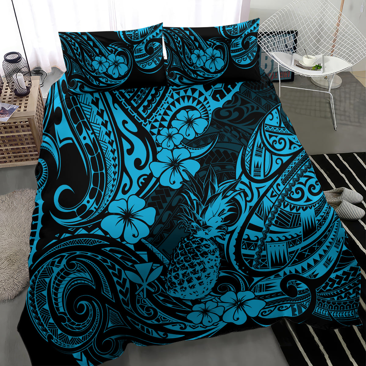 Blue and teal Polynesian-style bedding set with tropical floral and tribal pattern, bed view