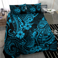 Blue and teal Polynesian-style bedding set with tropical floral and tribal pattern, bed view