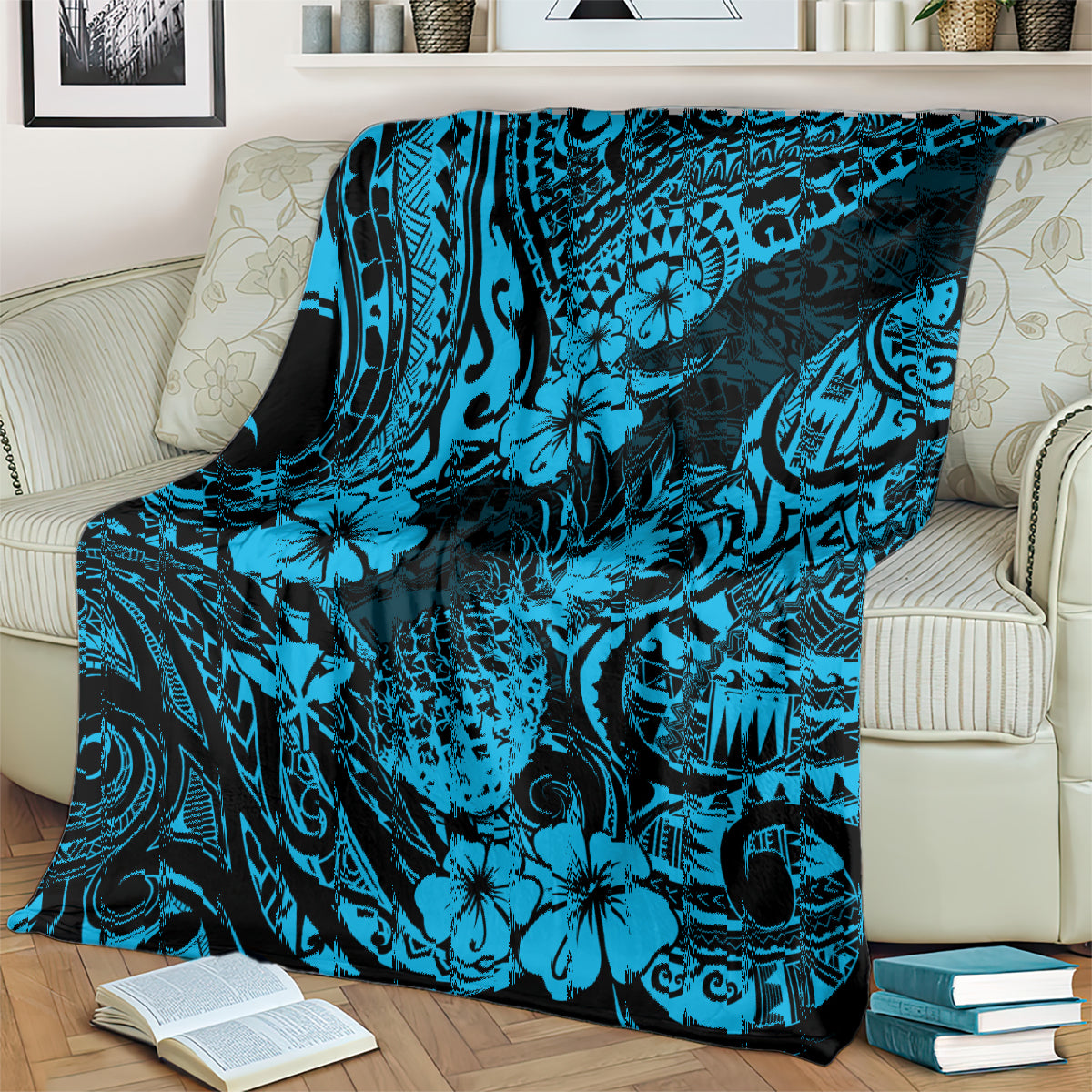 Sky blue pineapple and hibiscus patterned blanket draped over bed