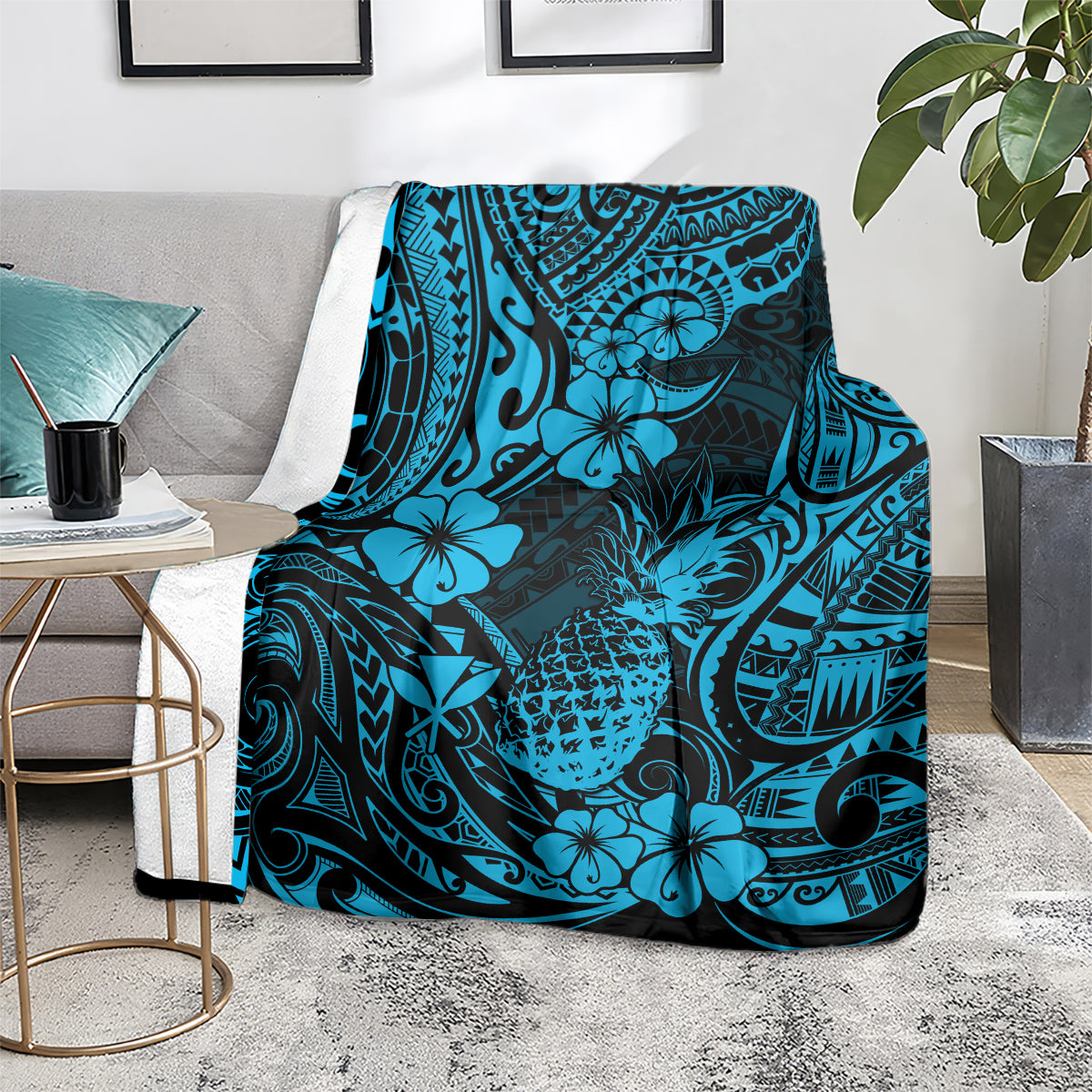 Sky blue pineapple and Polynesian floral pattern blanket over armchair