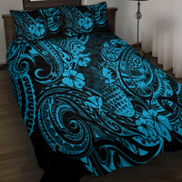 Blue and black quilt bed set with tropical floral and paisley swirl motifs, two pillowcases