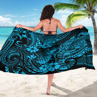 Blue sarong with teal swirls and floral motifs, wrapped around wearer