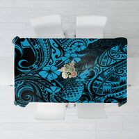 Blue polynesian tablecloth with pineapple and tiki-style swirl pattern, draped flat