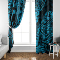 Pair of blue tropical patterned window curtains with pineapple and Polynesian motifs at side.