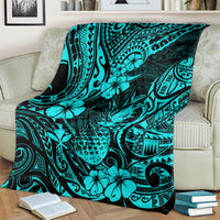 Turquoise tropical pineapple pattern blanket spread across a couch
