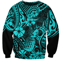 Turquoise crewneck sweatshirt with pineapple-floral Polynesian print and black sleeves