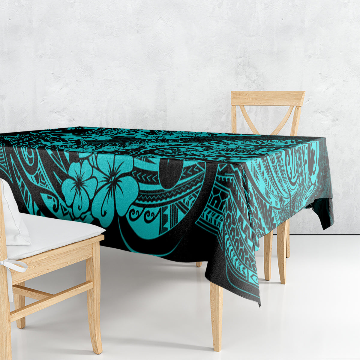 Turquoise tablecloth draped on dining table, pineapple and Polynesian swirl pattern