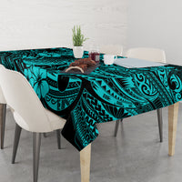 Turquoise tablecloth on dining table with pineapple and Polynesian swirl pattern, black