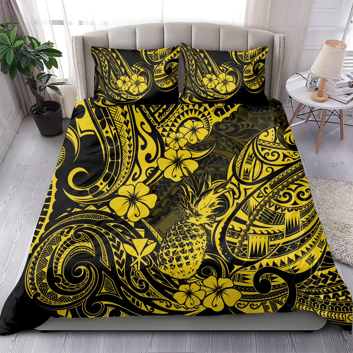 Yellow and black Polynesian pineapple bedding set with matching pillow shams on bed