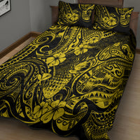 Yellow and black quilt and pillowcases on bed, pineapple and swirl Polynesian print