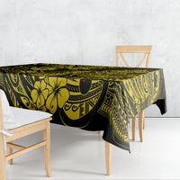 Yellow and black pineapple Polynesian tablecloth over rectangular table, corner drape