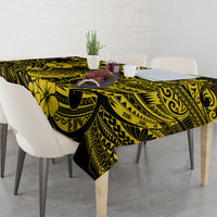 Yellow and black pineapple Polynesian tablecloth on dining table with chairs and centerpiece