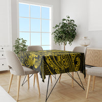 Yellow and black pineapple Polynesian tablecloth on dining table with four chairs