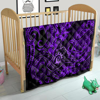 Purple and black quilt blanket with shaka-style swirls and hibiscus flower motifs