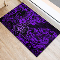 Purple rubber doormat with swirling Polynesian tribal motifs and flower shapes in black.