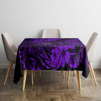 Purple tablecloth with tiki and tribal swirl pattern covering rectangular table