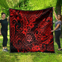 Red Polynesian pattern quilt with black border and tropical flower swirls