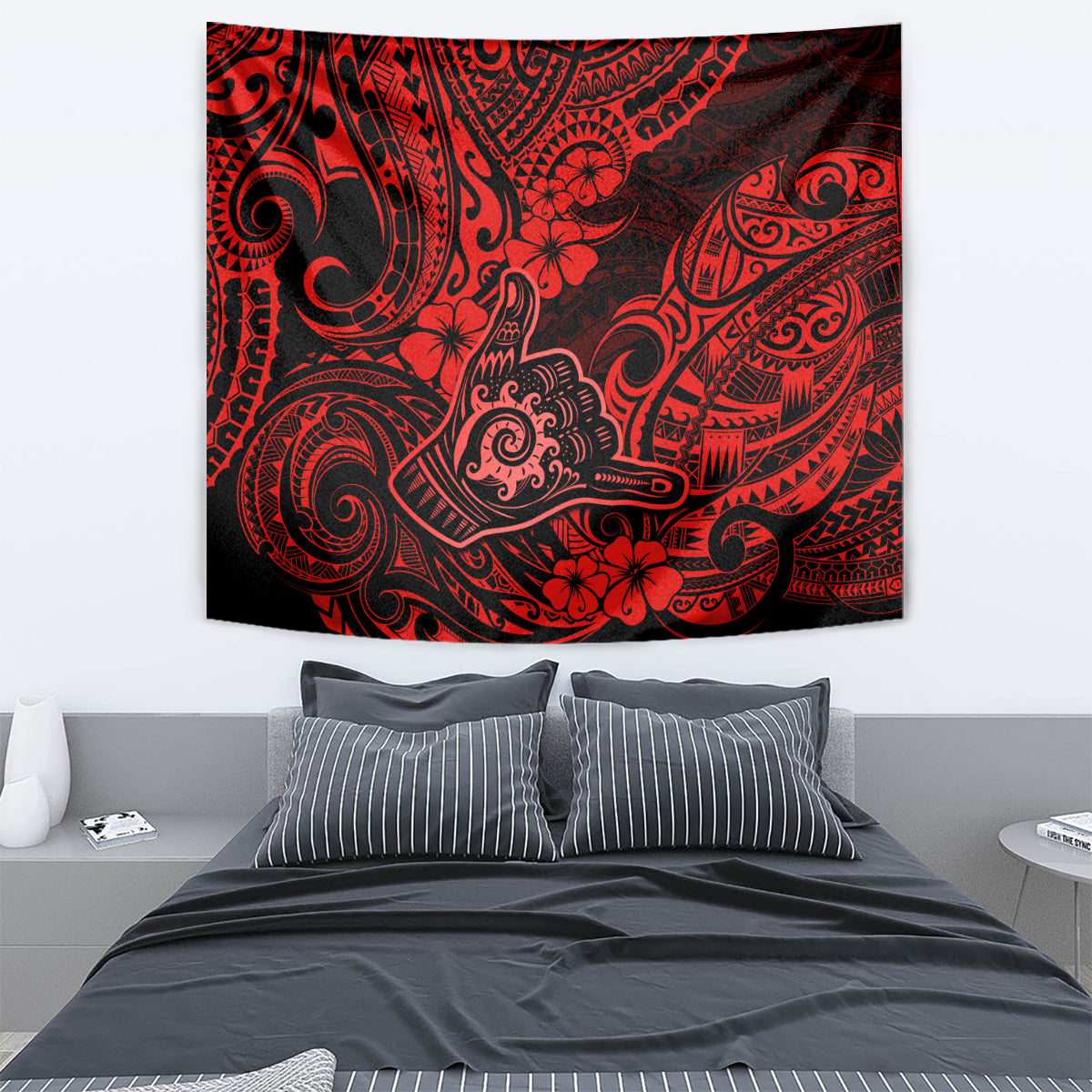Red and black Polynesian tapestry featuring ornate swirls and flower motifs